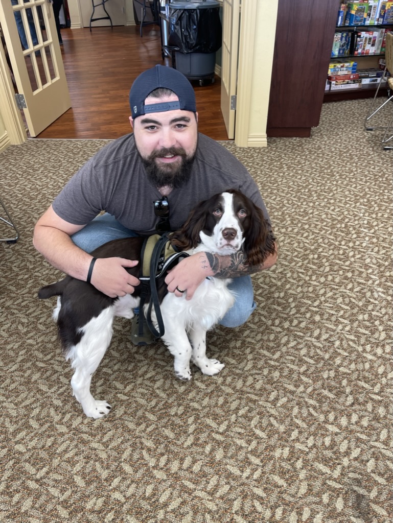 Dakota hugging Cocker Spaniel Paolo